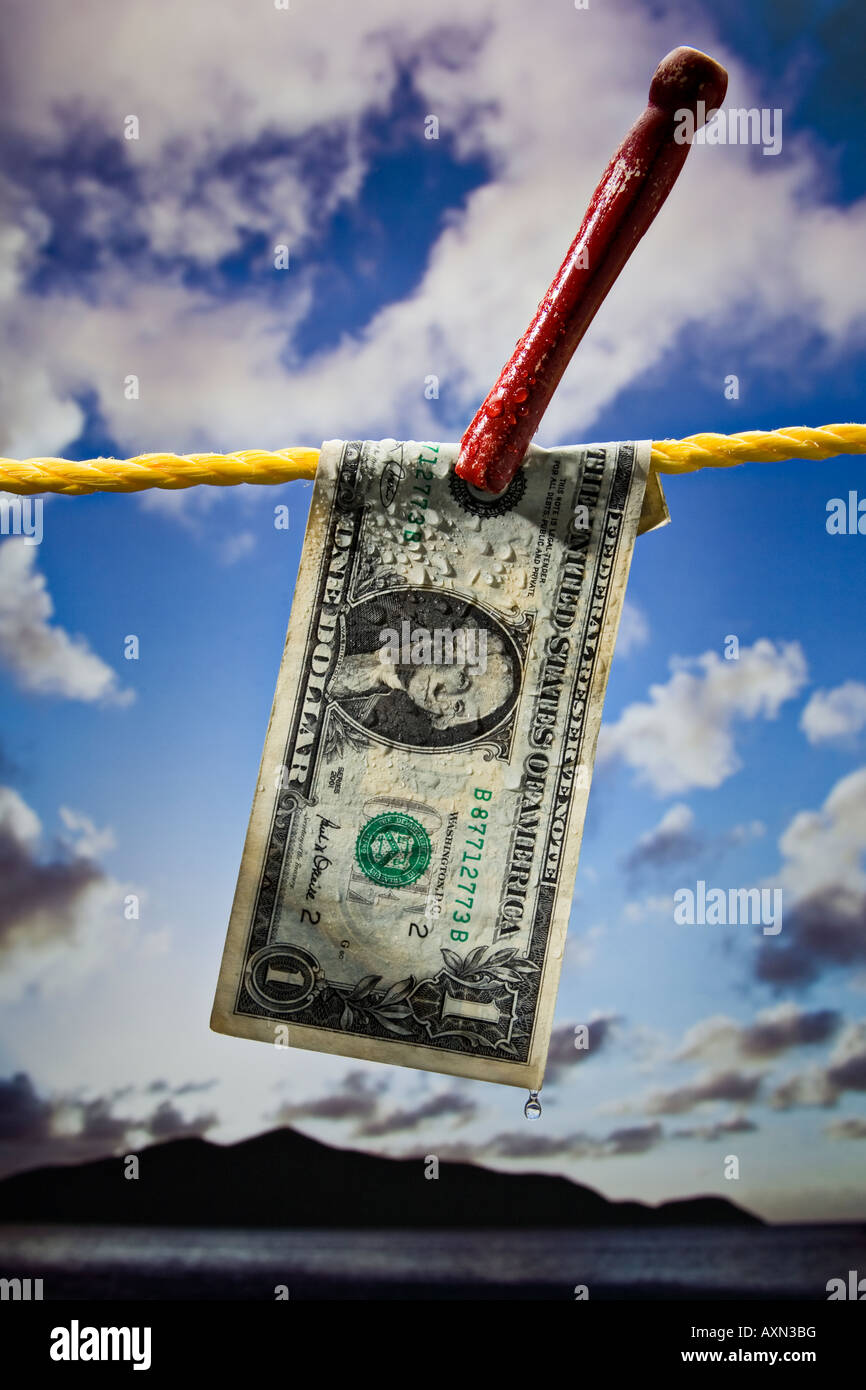 dollar bill drying on a clothsline outdoors Stock Photo