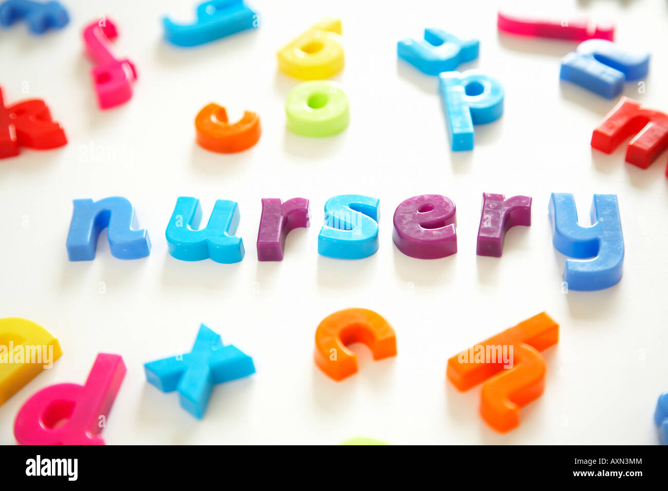 Alphabet magnetic childrens learning letters spelling out Nursery. Stock Photo