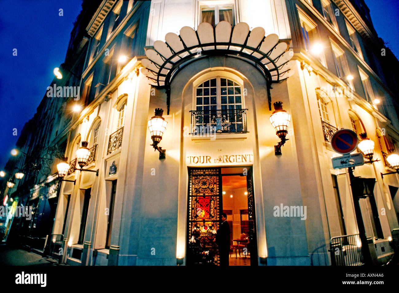 France Paris, French Restaurant, 'La Tour d'Argent', Haute Cuisine Entrance Lit Up at Night, front door with lights, fancy restaurant, door open Stock Photo