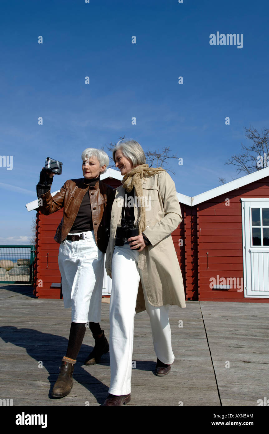 Mature women walking outdoors hi-res stock photography and images - Alamy
