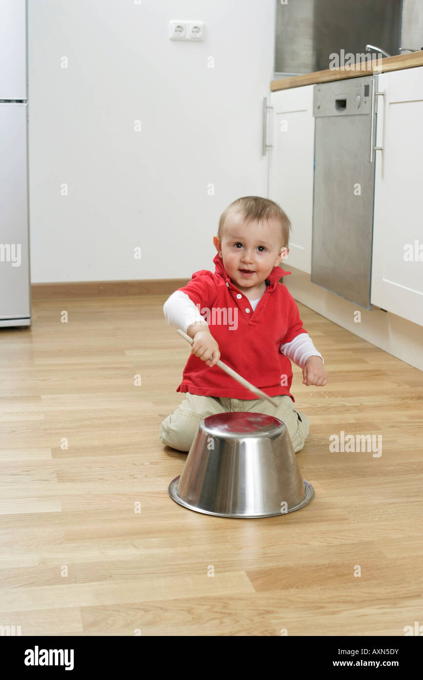 Baby boy drumming on a dish Stock Photo Alamy