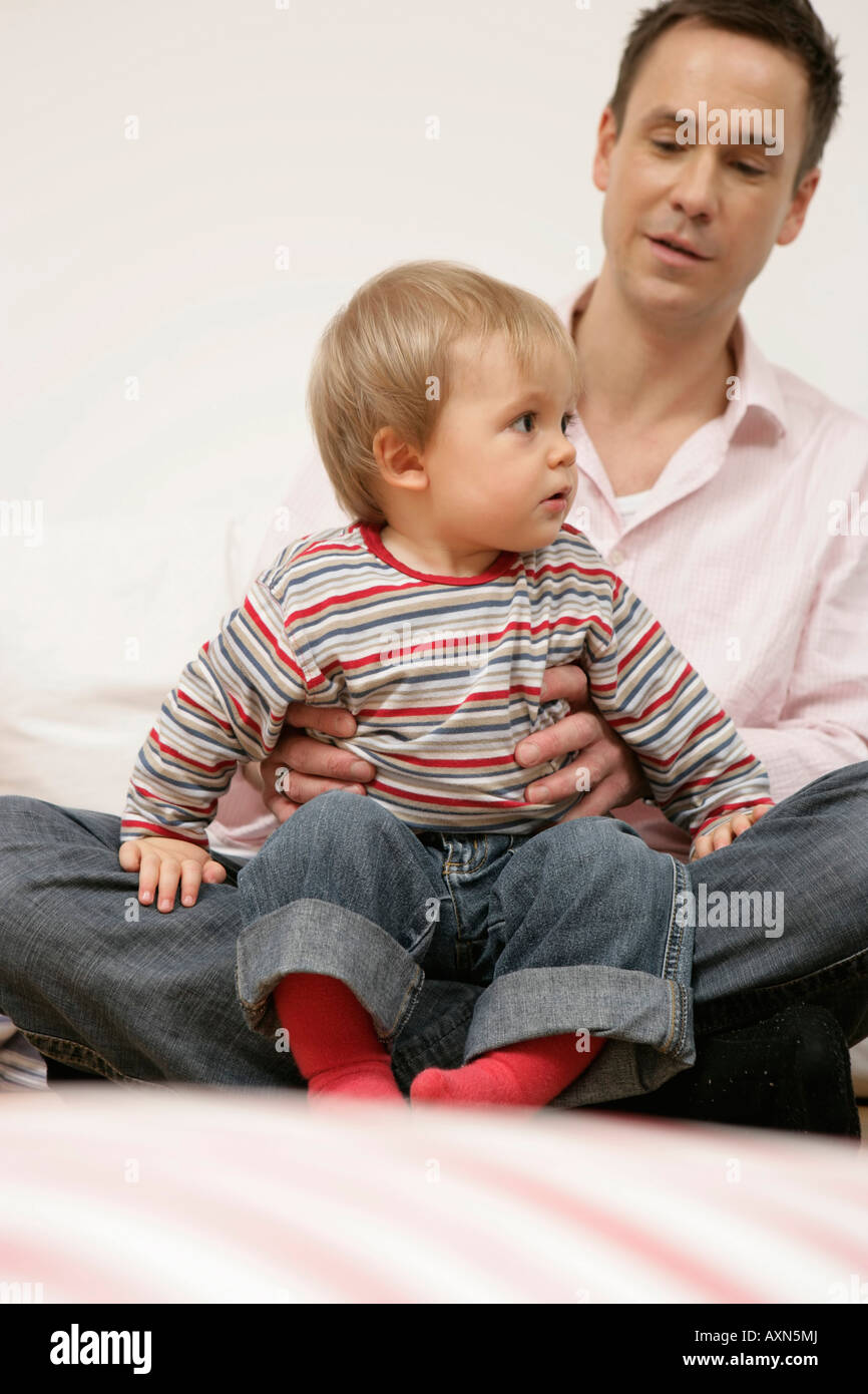 Sitting on fathers lap hi-res stock photography and images - Alamy