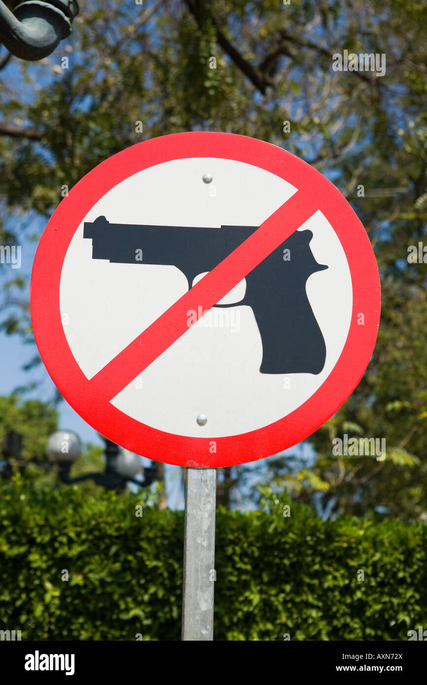 Sign prohibiting handguns in central square Santa Ana El Salvador Stock Photo
