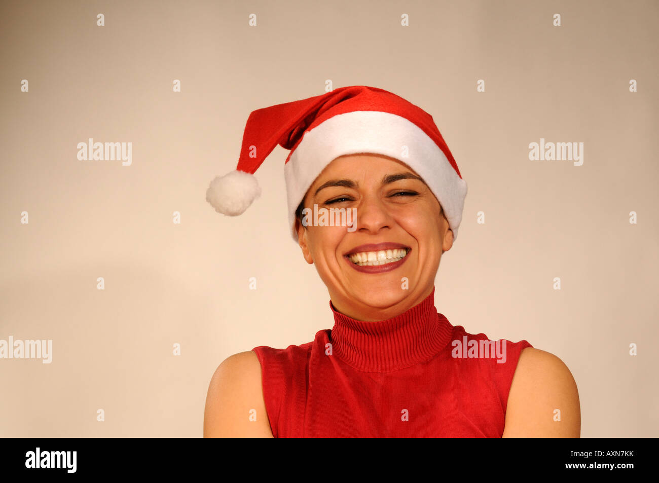 Studio portrait of woman with Santa hood Stock Photo