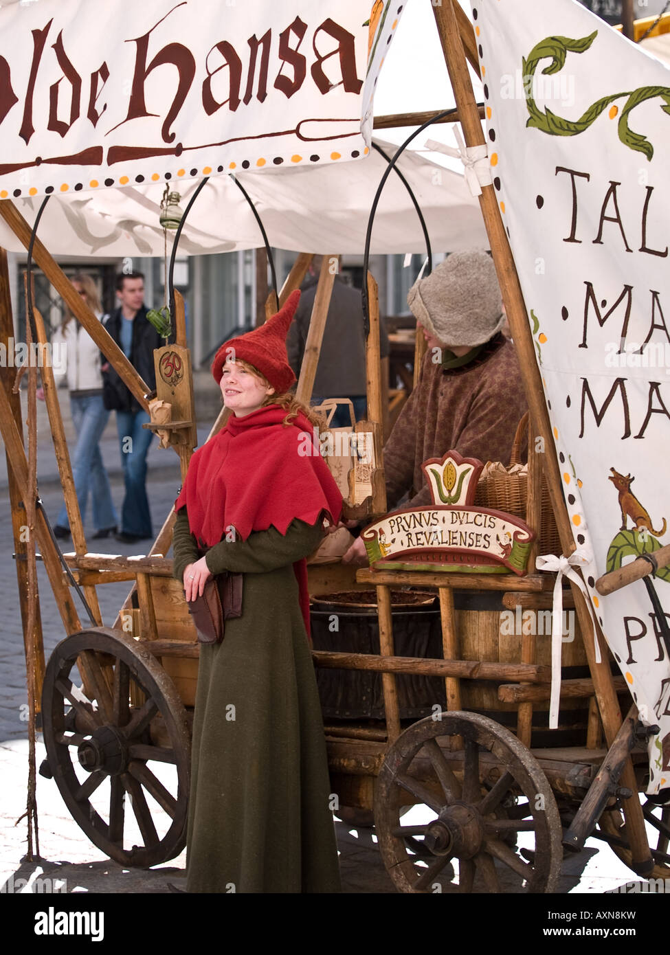 Girl in mediaeval dress at market stall Tallinn Estonia Stock Photo