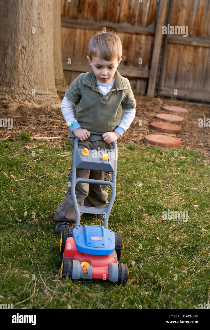 Boy lawnmower hi res stock photography and images Alamy