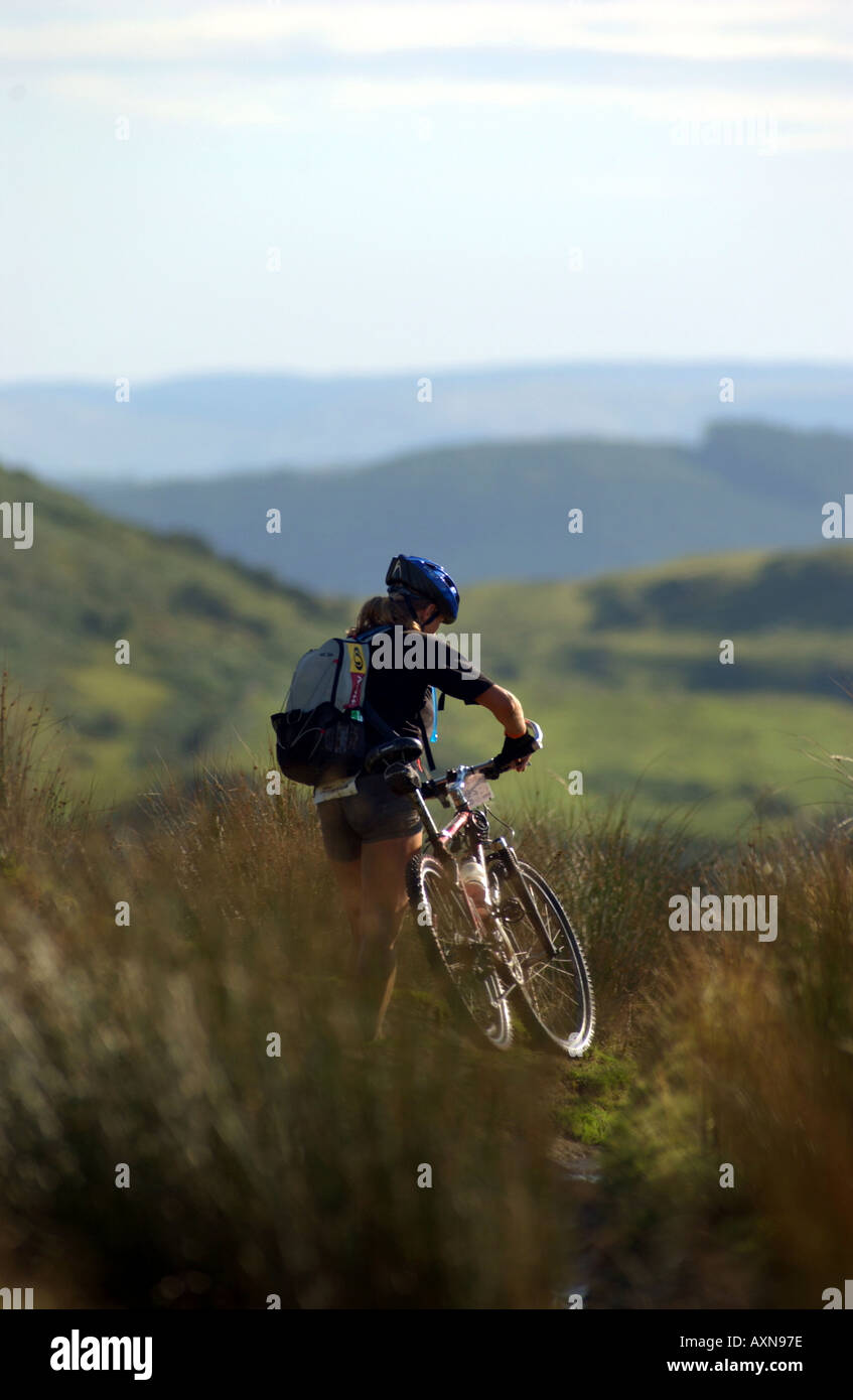 Mountain bike girl push Stock Photo Alamy