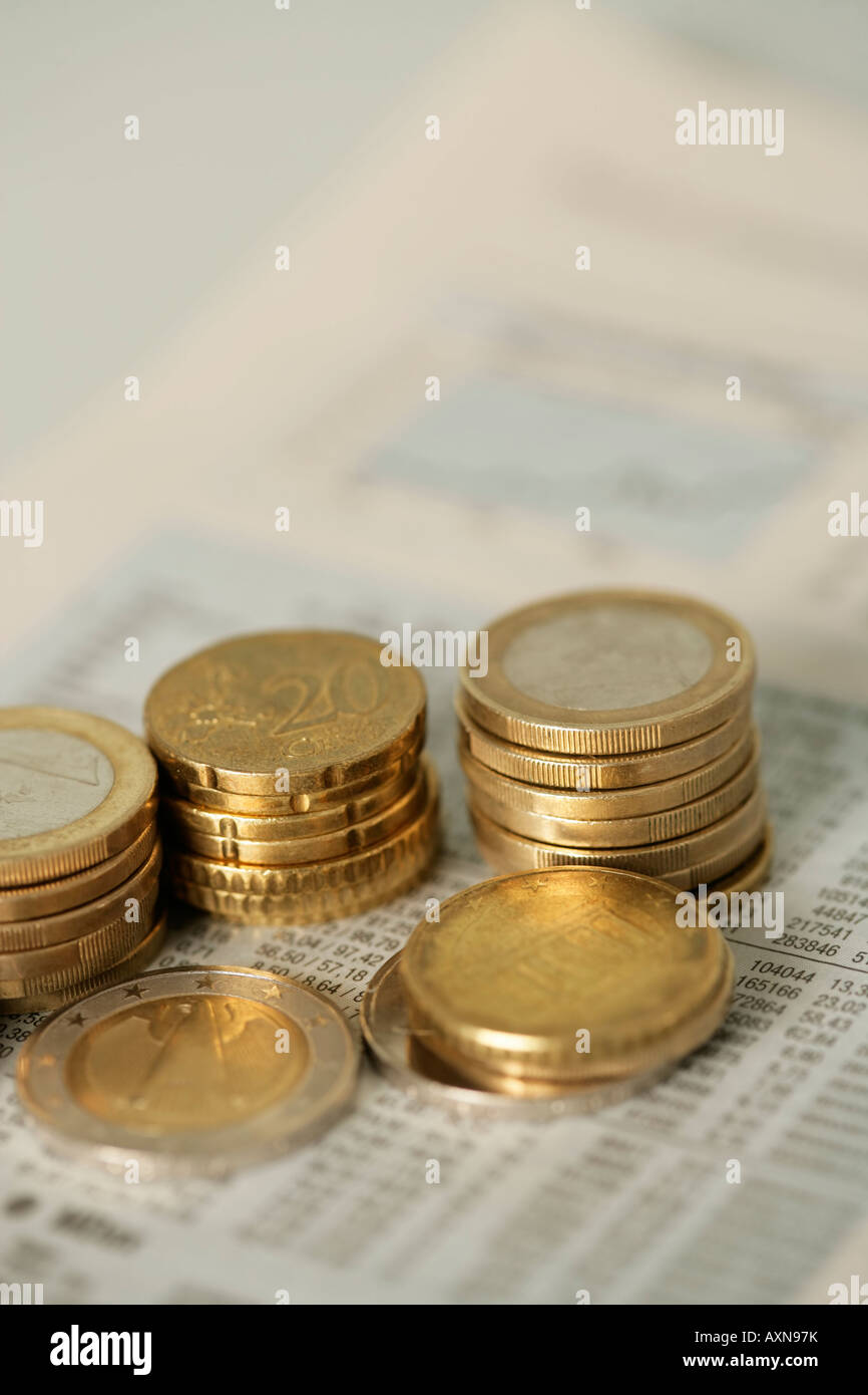 1-Euro- and 50-Eurocent coins next to an index showing the cash value, selective focus Stock Photo
