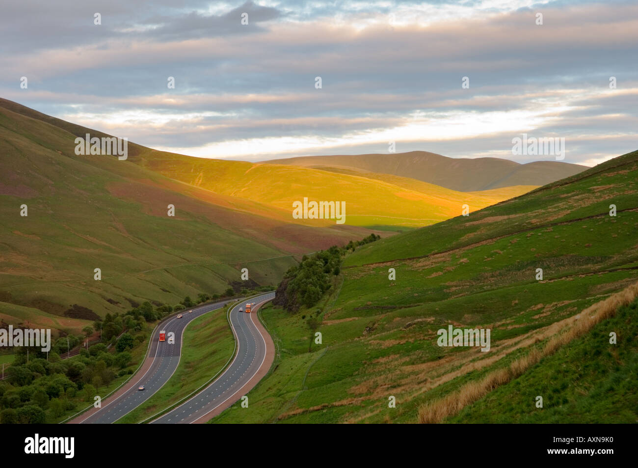 M6 motorway passing through east Cumbria hills, the Howgill Fells, 2 miles south of Tebay northwest England. Looking south. Stock Photo