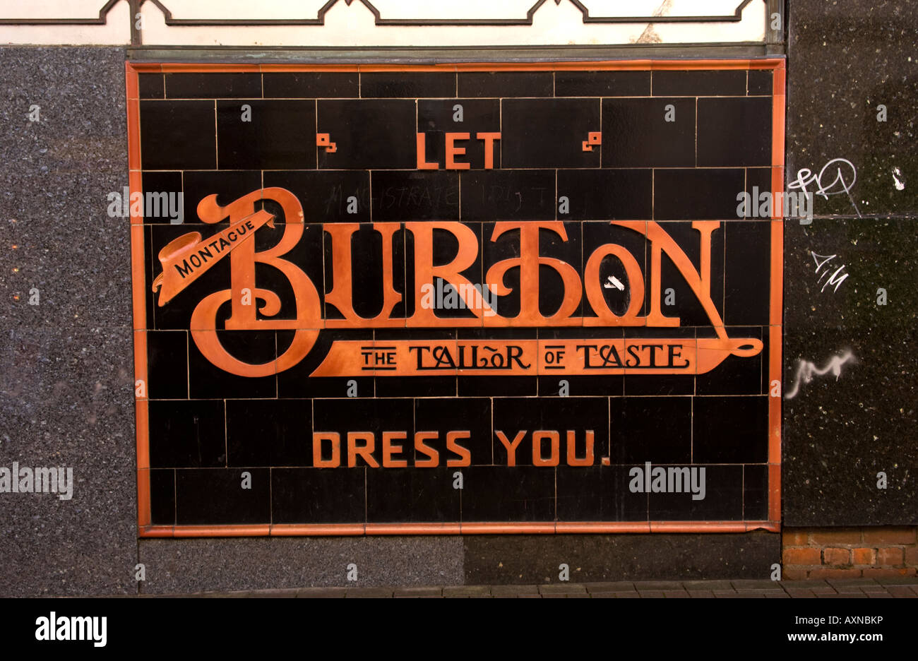 Sign advertising Burton the Tailor on side of shop in Abergavenny Monmouthshire South Wales UK EU Stock Photo