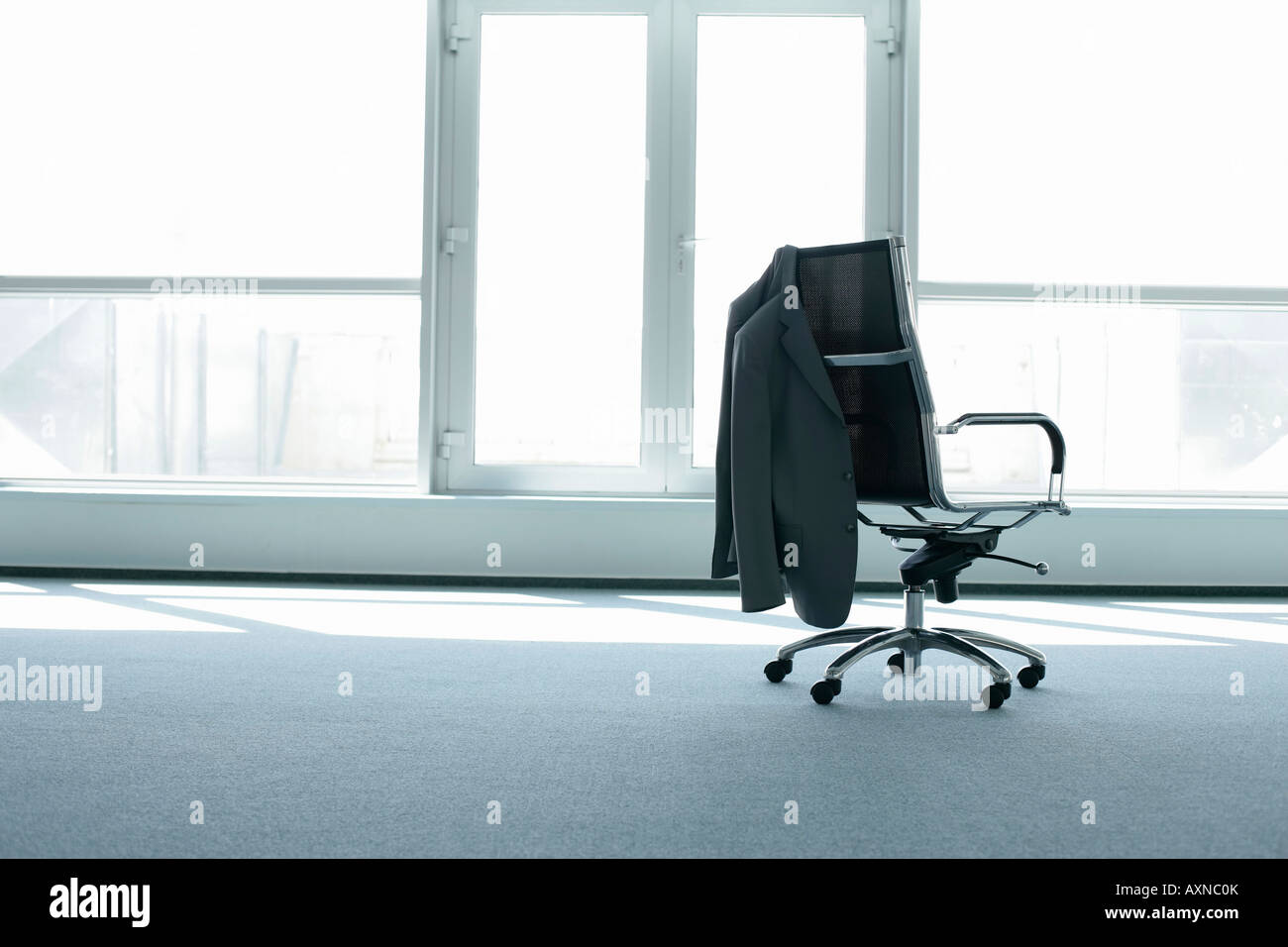 Suit jacket hanging on office hires stock photography and images Alamy