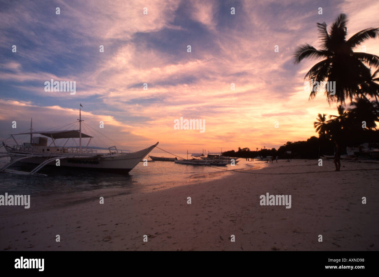 A tropical sunset over Panglao Island in the Southern Philippines Stock