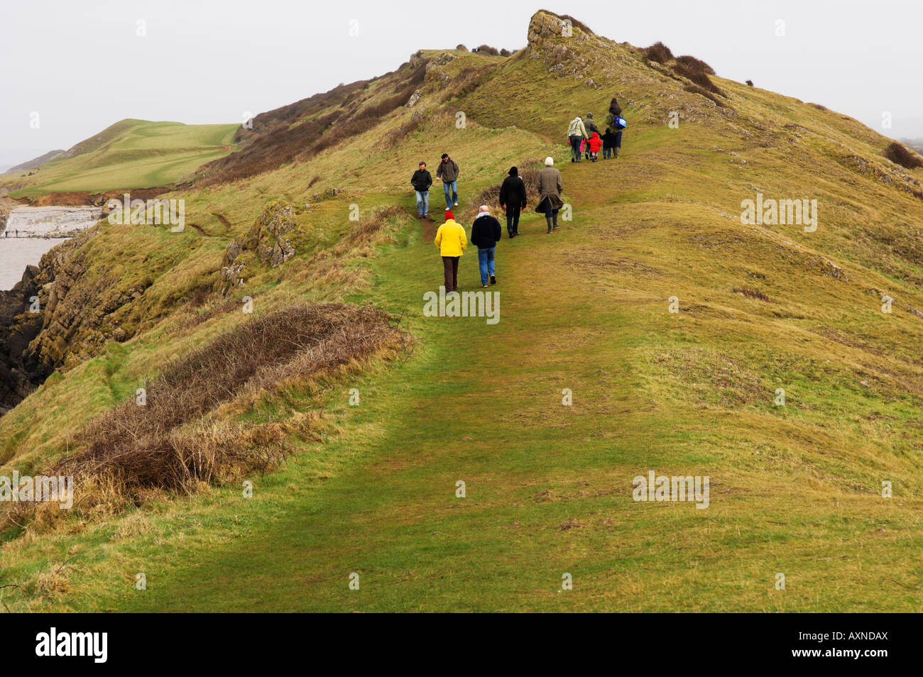 People on winter walk at 'Sand Point' Avon England Stock Photo