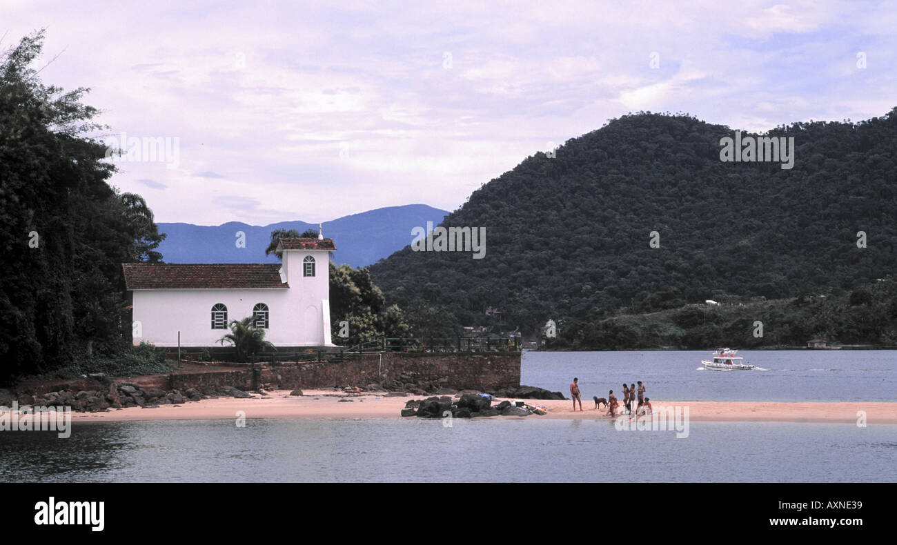Wealthy Brazilian family picnic on a beach that can only be reached by