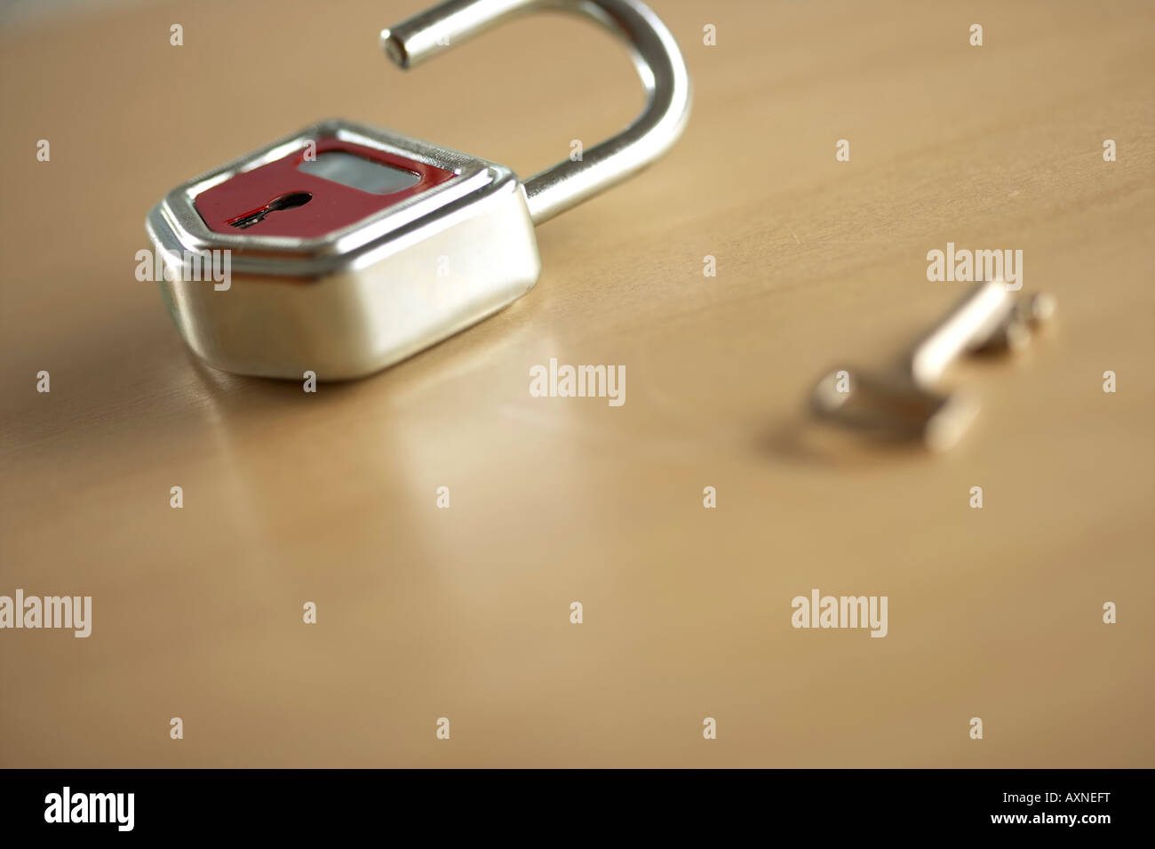 An unclosed lock and a key Stock Photo