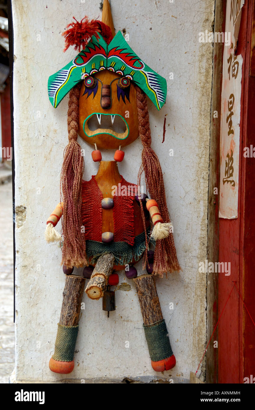 A hand-made doll hanging by a local shop. Lijiang, Yunnan, China. Stock Photo