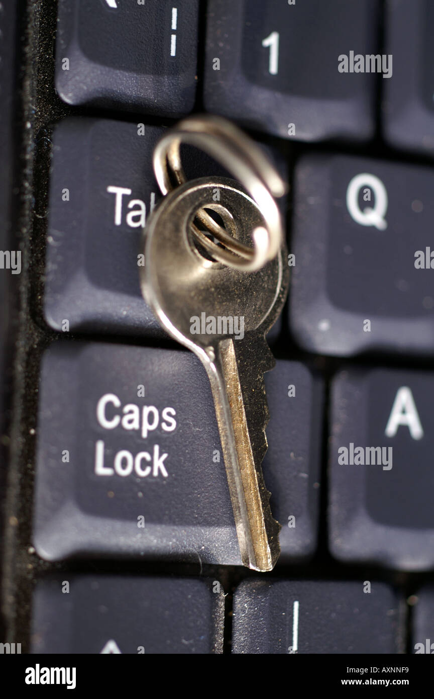 Key by Caps lock button on laptop keyboard security digital risk management  Stock Photo - Alamy