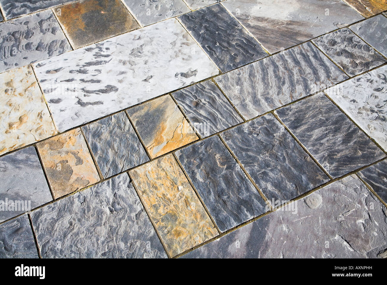 Ripple marks in stone floor tiles outdoors Wales UK Stock Photo