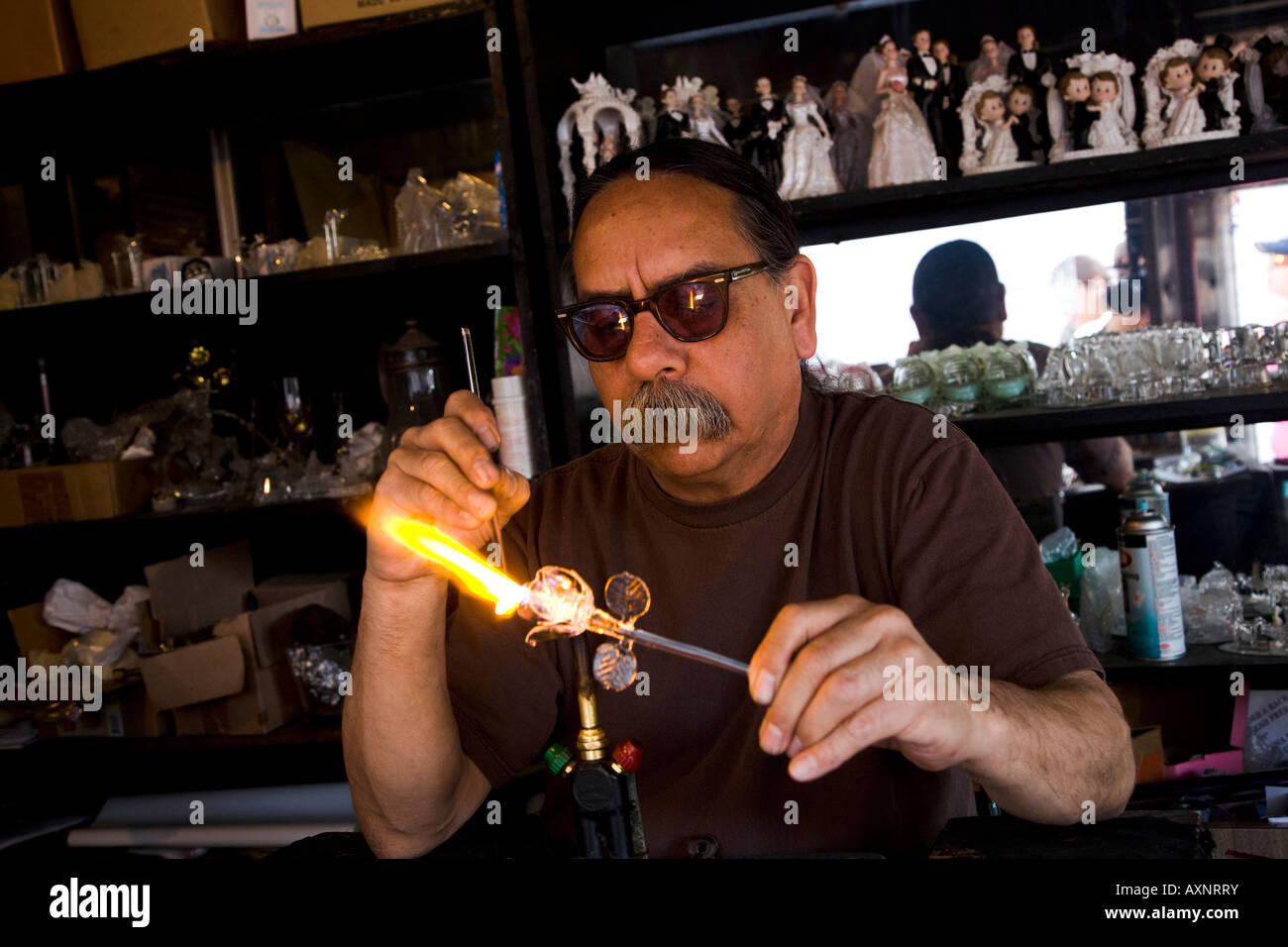 Glass blower in his shop at Olvera Street Downtown Los Angeles