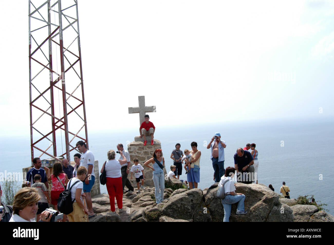 Pilgrims gathered at Cabo Finisterre, Galicia, Spain Stock Photo