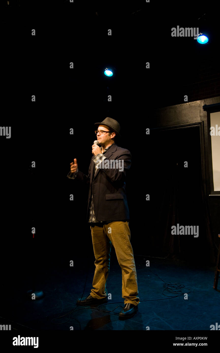 comedian onstage telling jokes Stock Photo