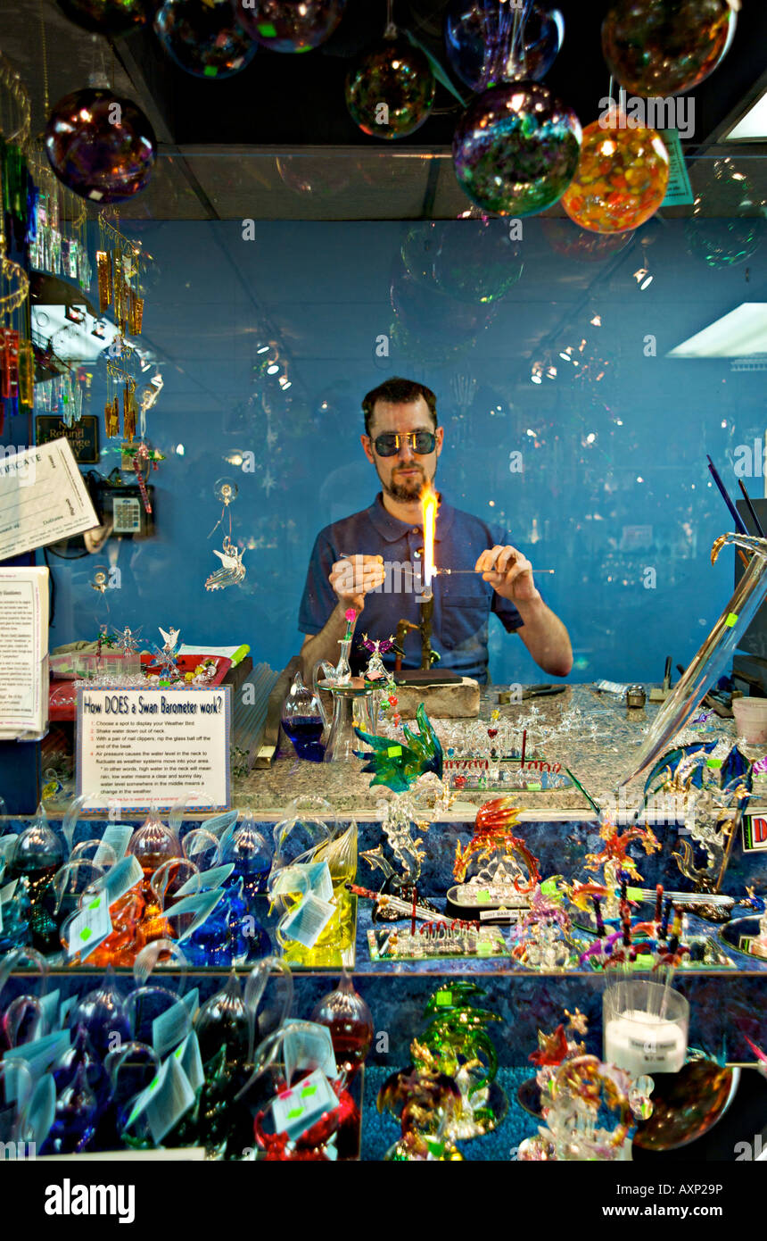 Glass blowing artist displaying his craftsmanship in a store Helen ...