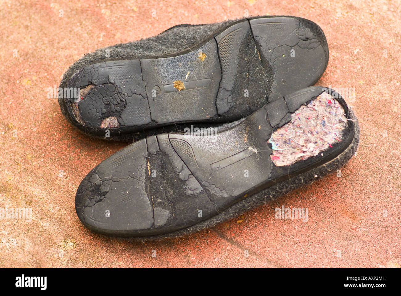 A pair of old slippers with worn soles and heels Stock Photo - Alamy