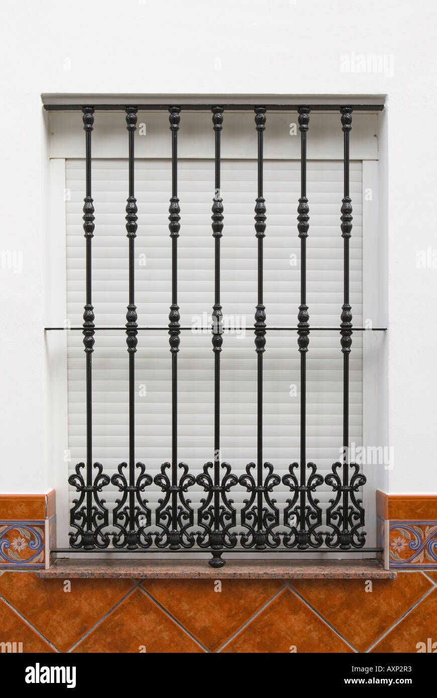 Spanish window with security grill Stock Photo - Alamy