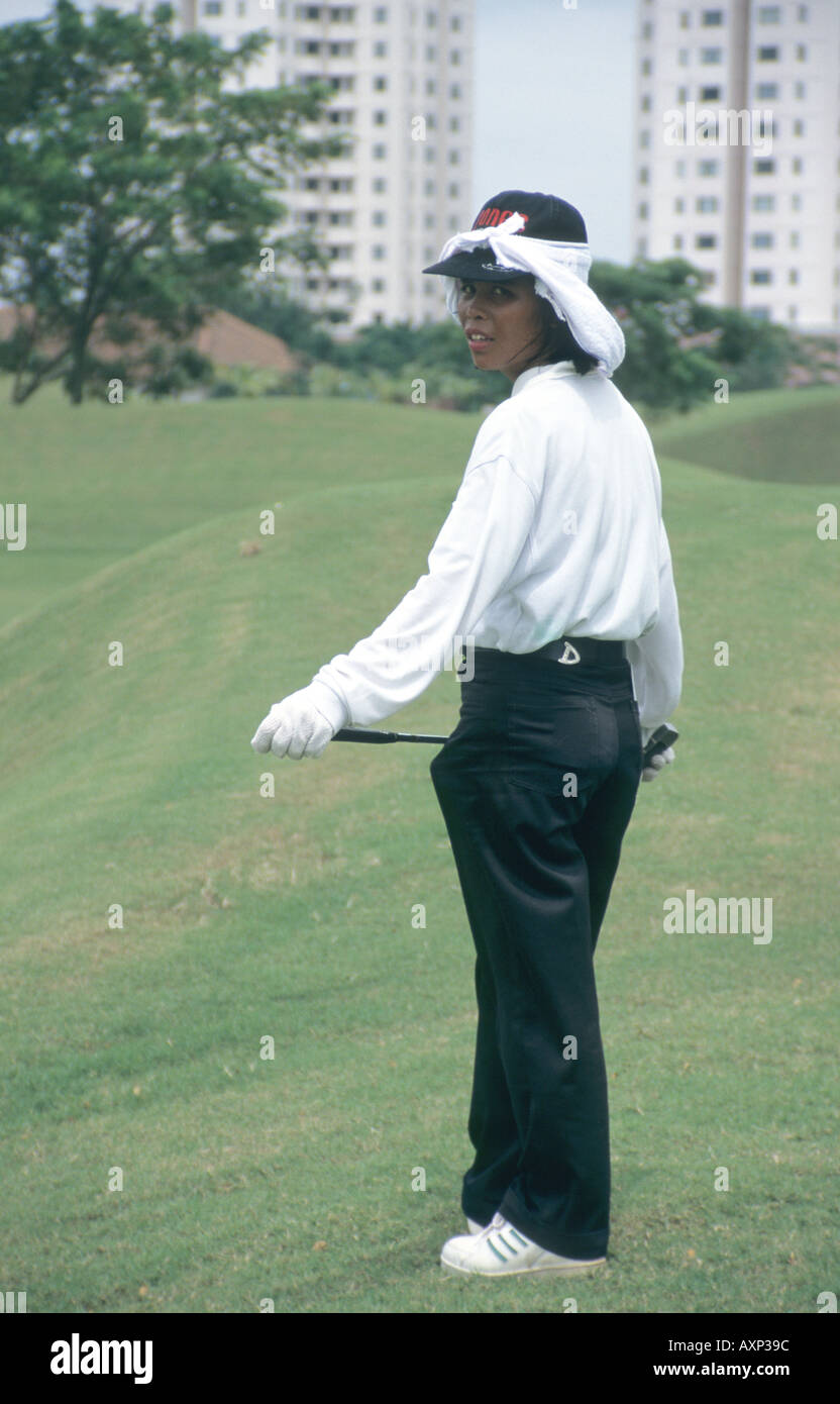Indonesian golf caddy Jarkarta Stock Photo Alamy