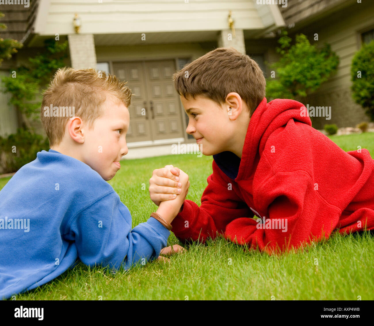 Boys arm wrestling Stock Photo