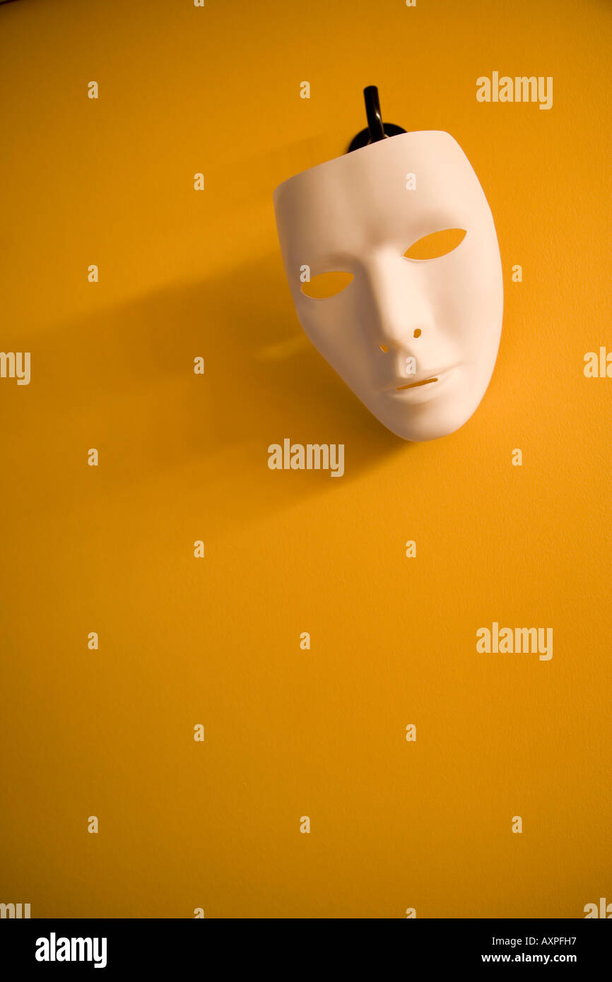 A mask hanging on the wall Stock Photo Alamy