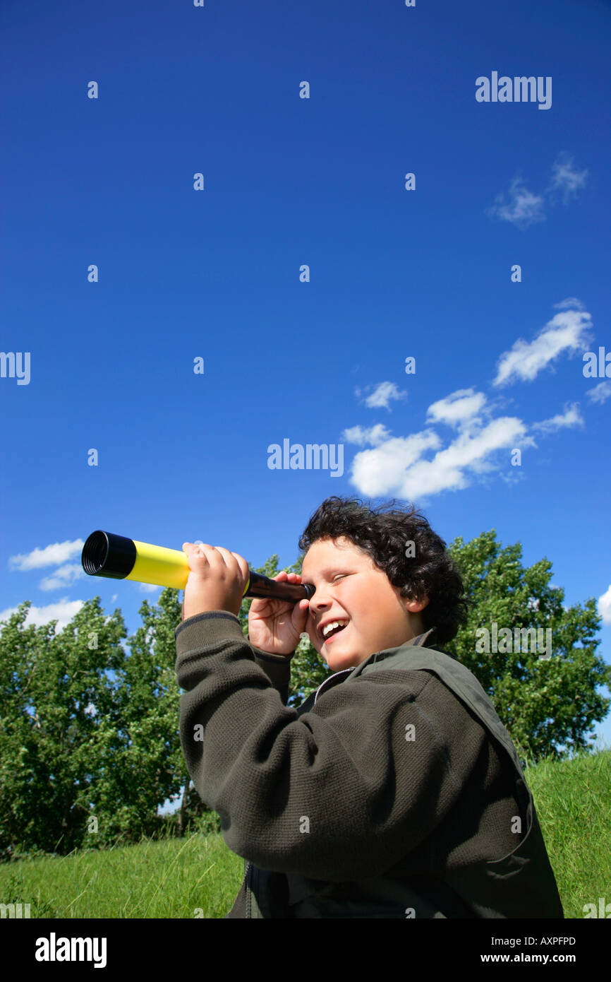 Boy with telescope Stock Photo Alamy