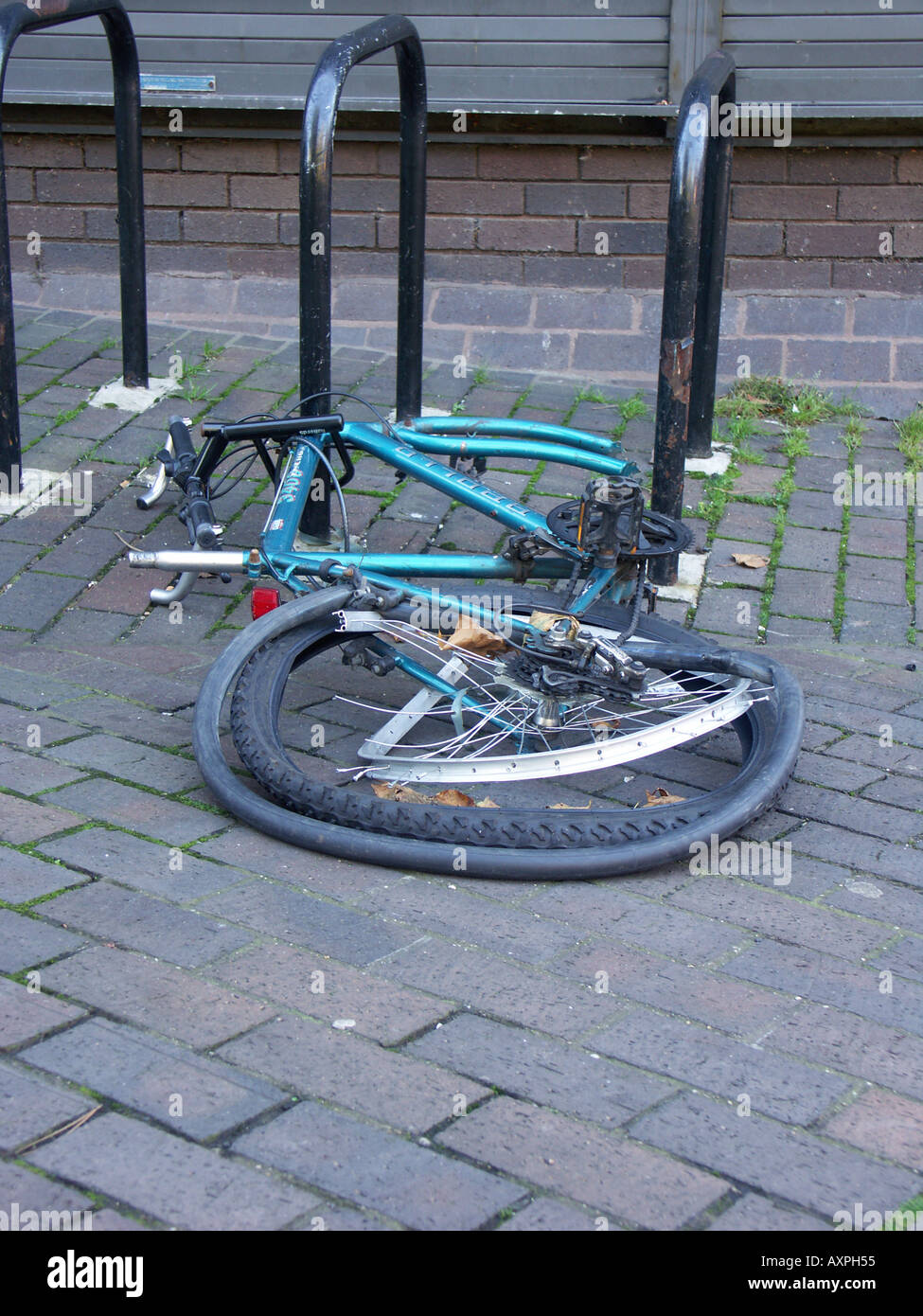 Stripped cycle still locked to bike stand Stock Photo Alamy