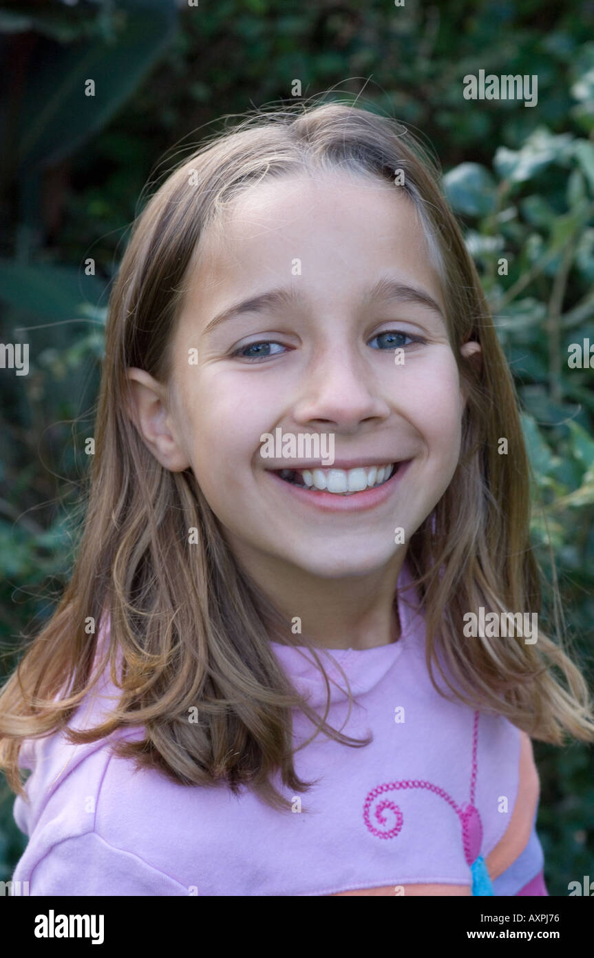 young girl smiling cheekily Stock Photo