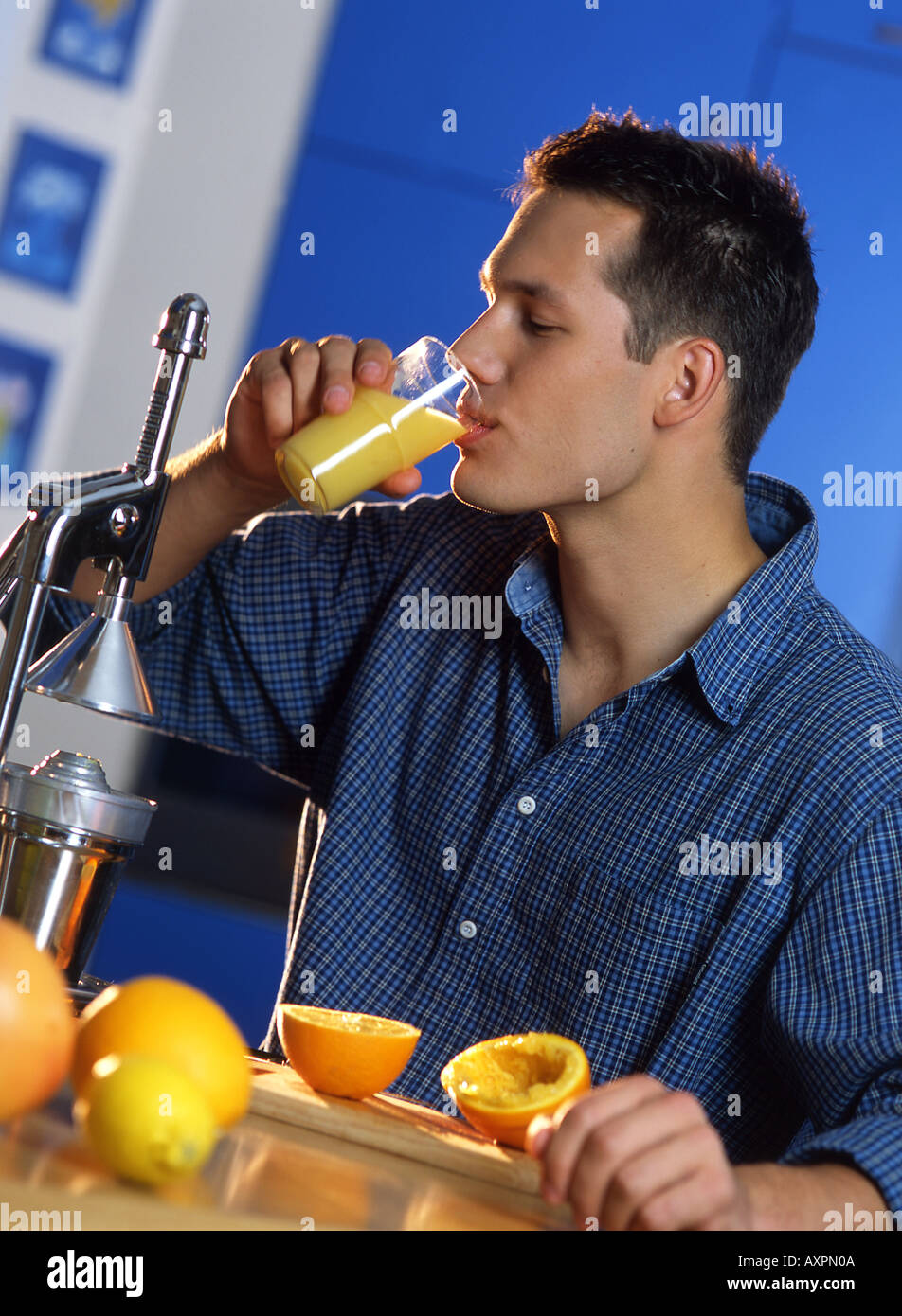 Thirsty man drinking orange juice hires stock photography and images