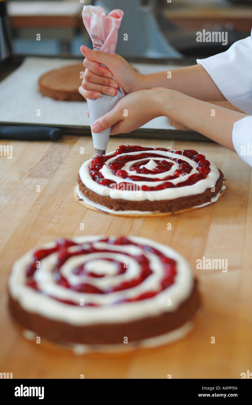 Pastry chef making Black Forest Cake Stock Photo - Alamy