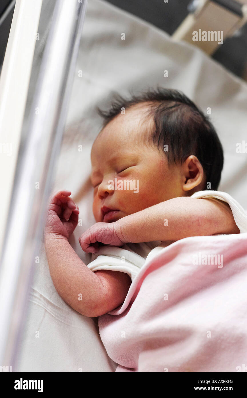 New born baby wrap in pink blanket Stock Photo Alamy