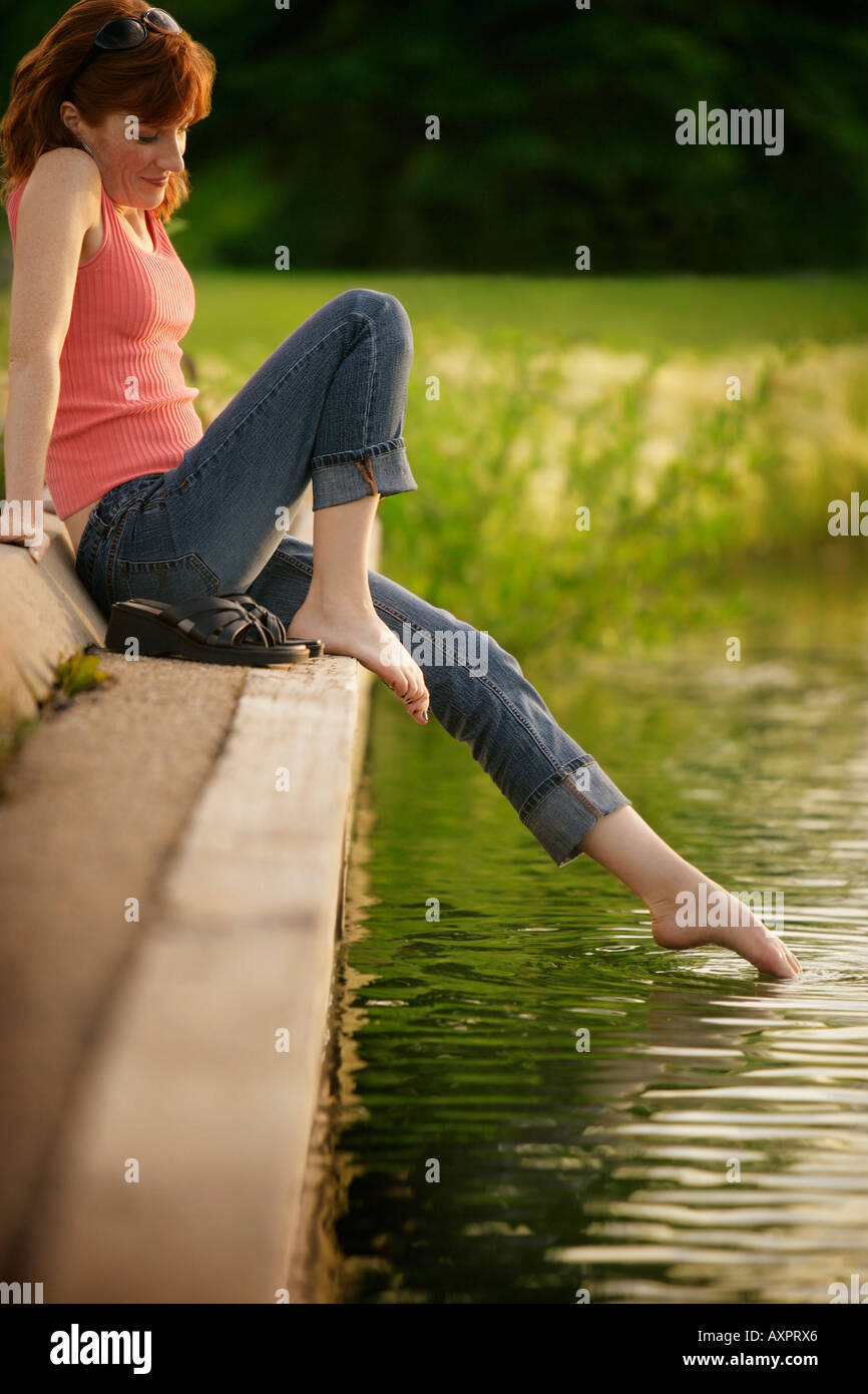 https://c8.alamy.com/comp/AXPRX6/woman-dipping-her-toe-in-water-AXPRX6.jpg