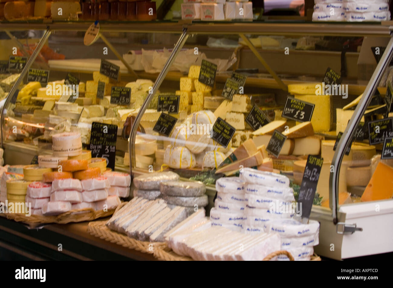 Cheese counter in deli shop Stock Photo