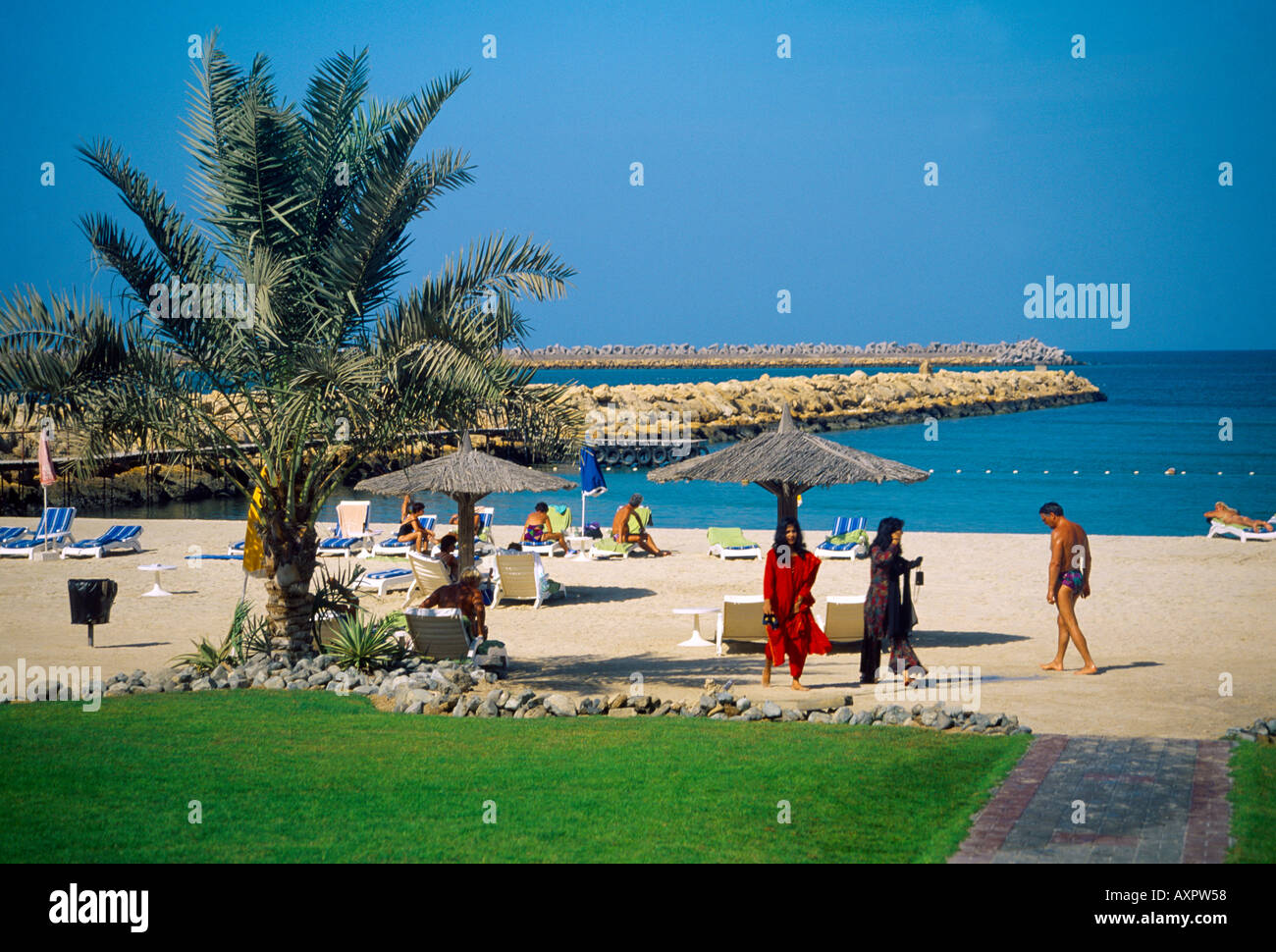 Sharjah UAE Continental Hotel Beach Tourists Sunbathing Stock Photo - Alamy