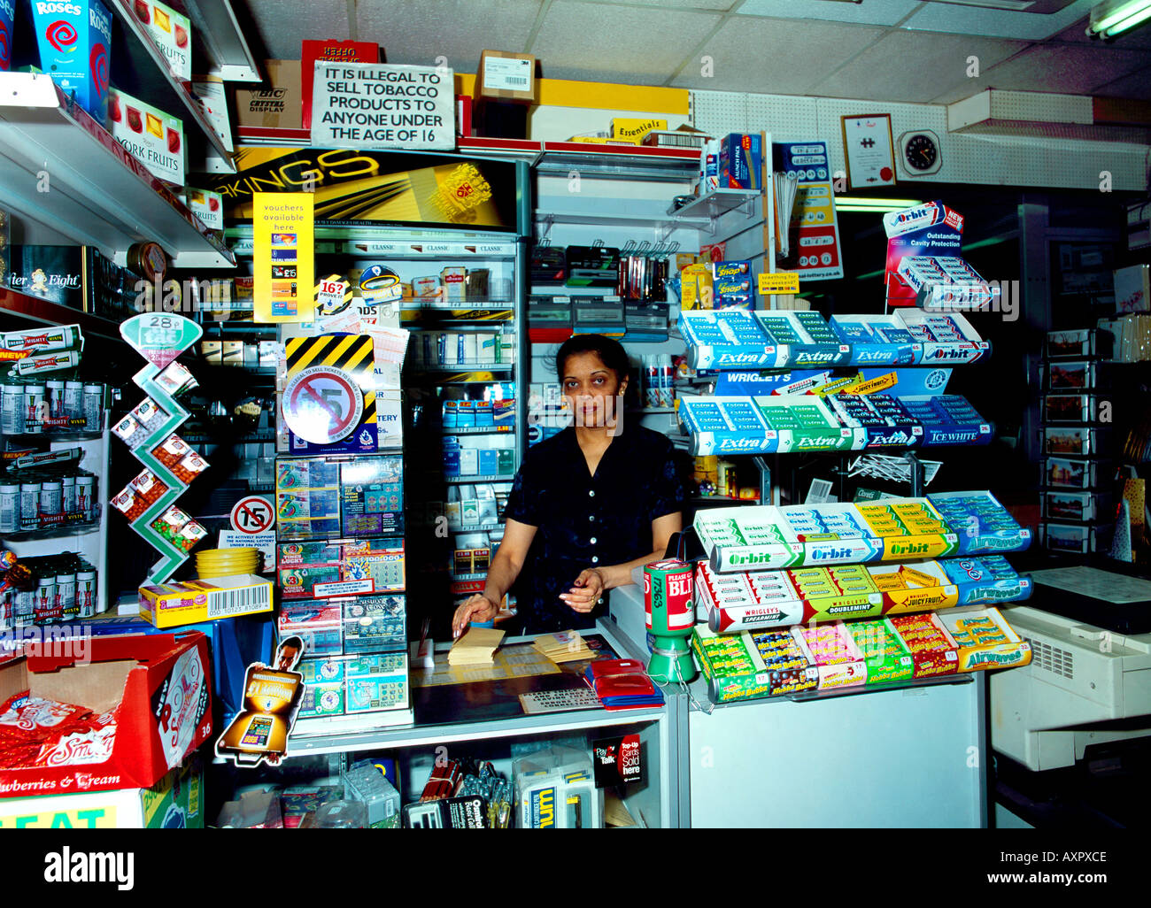 Newsagent Woman Behind Counter Stock Photo