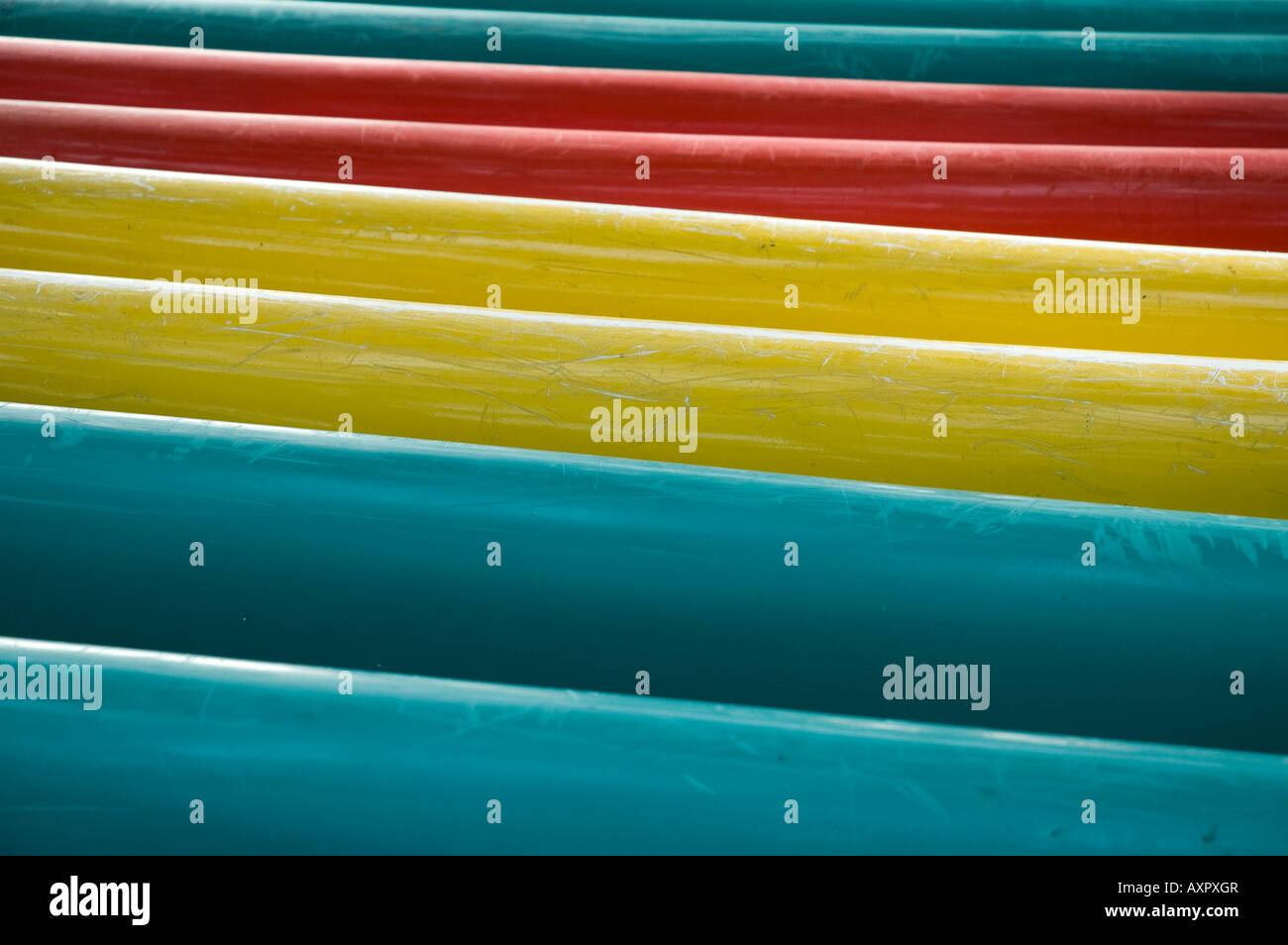 Colored canoes on a rack on Sepa Island. Stock Photo