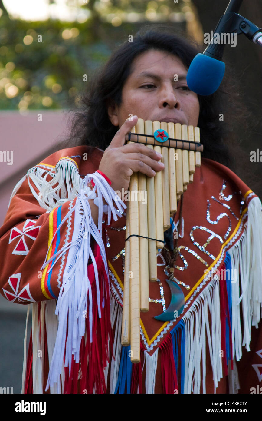 Peruvian man in native costume playing markamasis music with pan flute  Stock Photo - Alamy