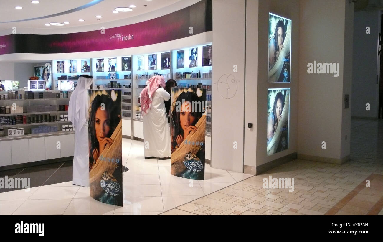 Local men in a perfume shop in Villaggio Mall, Doha. Stock Photo