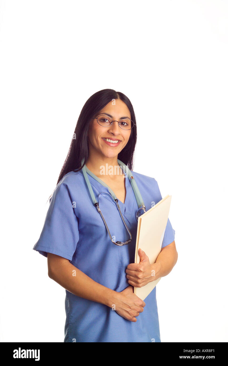 Nurse or doctor dressed in blue scrubs wearing glasses and holding