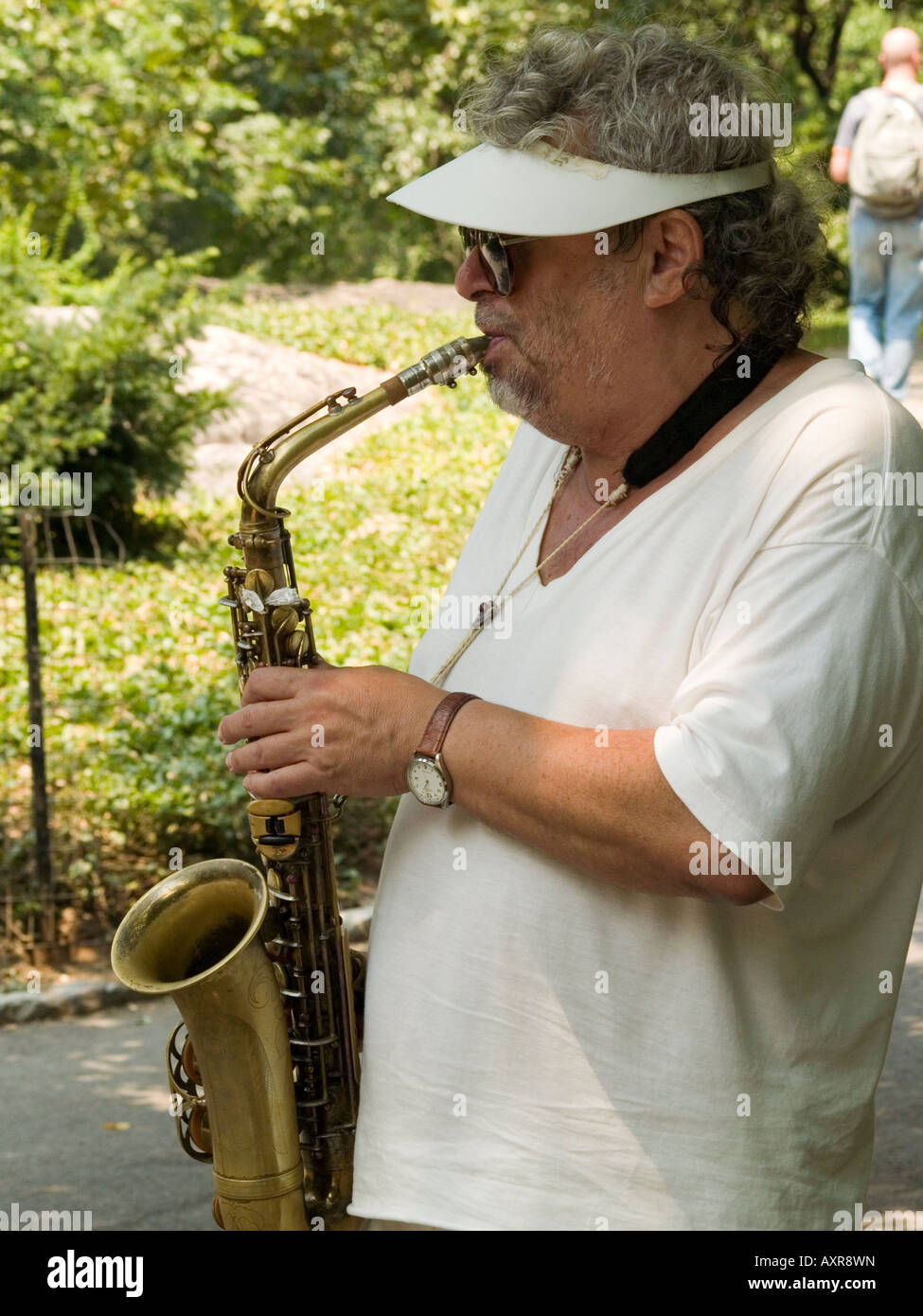 A man playing the saxophone in Central Park, New York City USA Stock