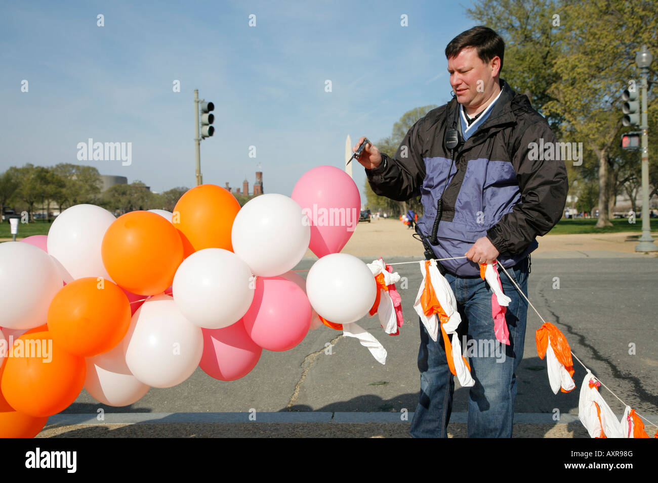 Man popping balloons, Cherry Blossom festival, Washington DC, USA Stock Photo