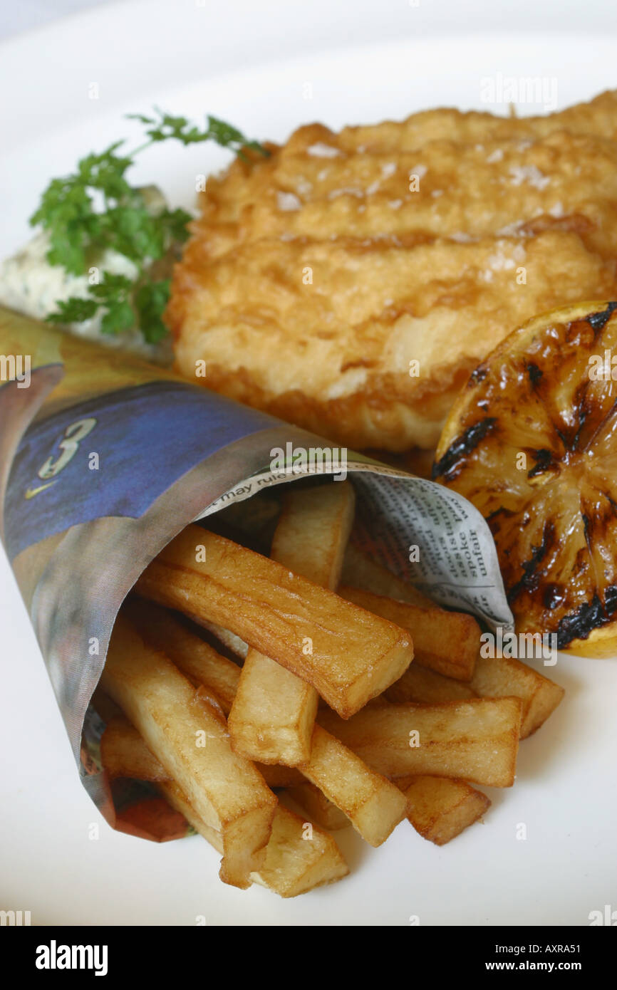 Traditional British fish and chips served in newspaper Stock Photo Alamy