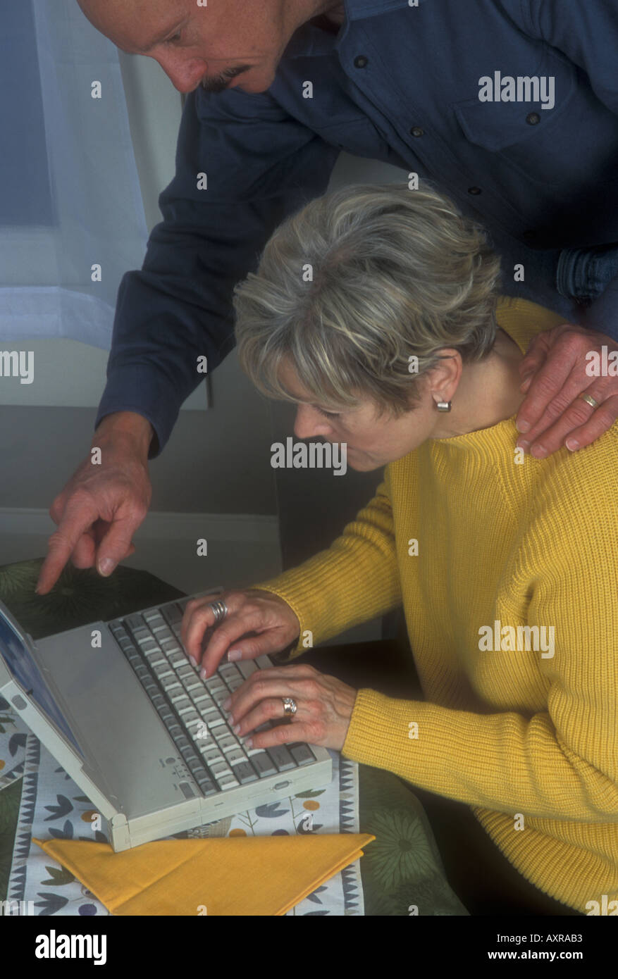 Man Helping Woman with Computer Stock Photo