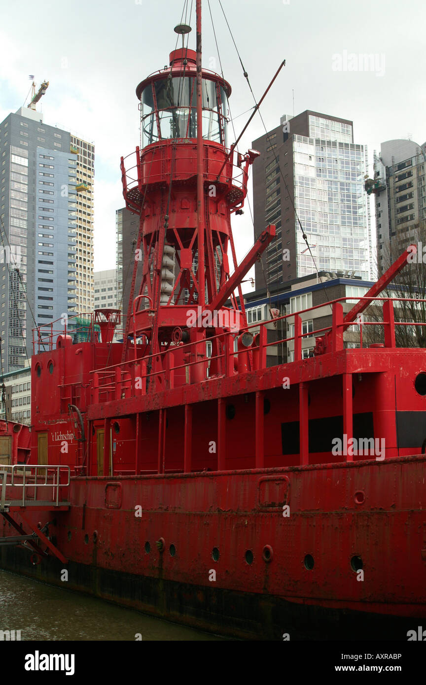 Red ship Wijnhaven Leuvehaven port Rotterdam city center moder buildings Netherlands lighthouse lightship town moor Stock Photo